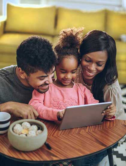 young family looking at new houses online